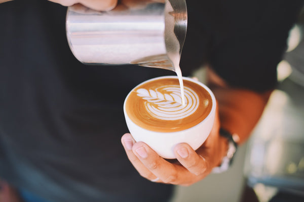 Latte coffee mug prepared by barista