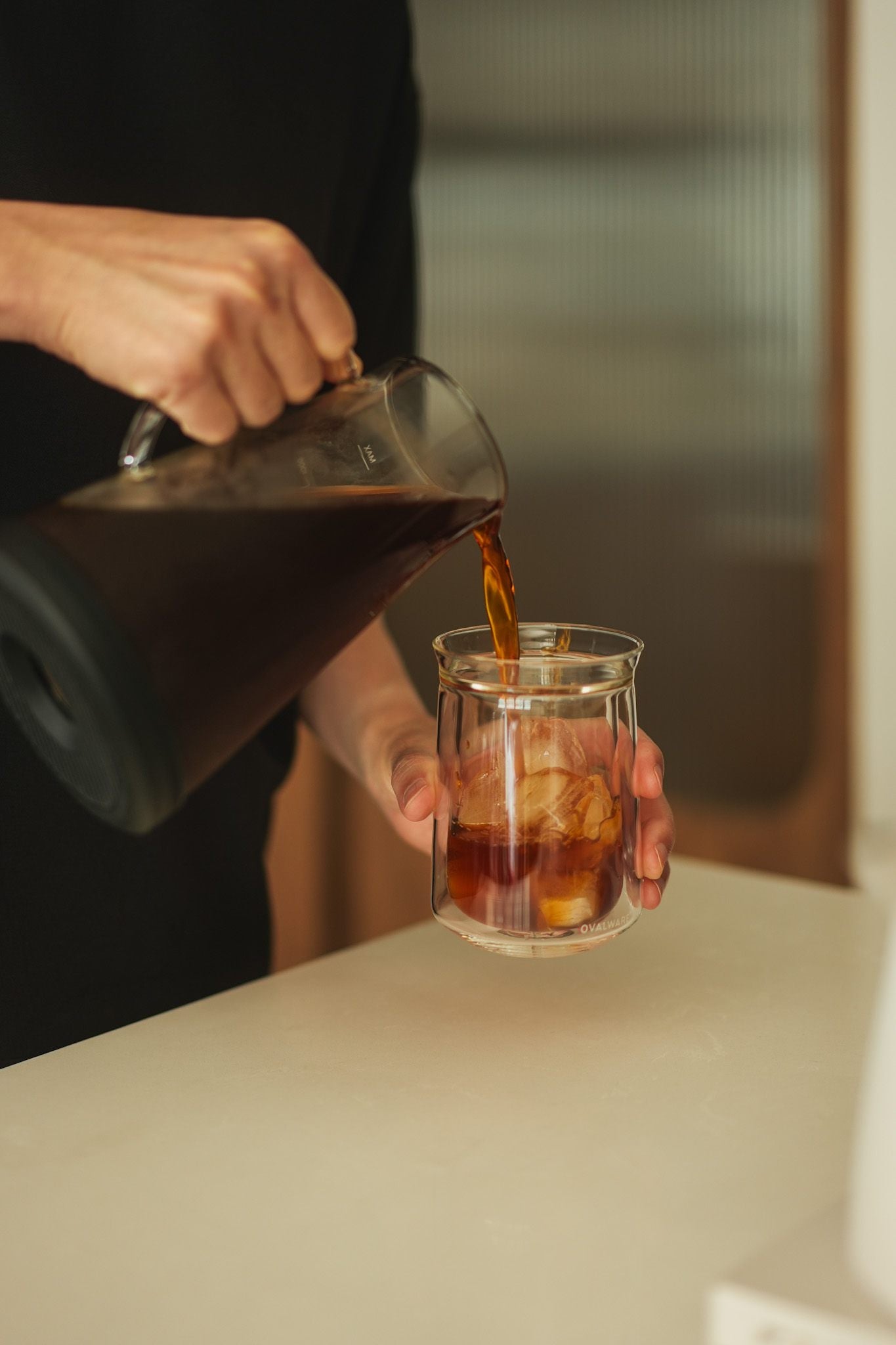 Cold brew coffee maker used with the double wall glass, poured coffee into the glass
